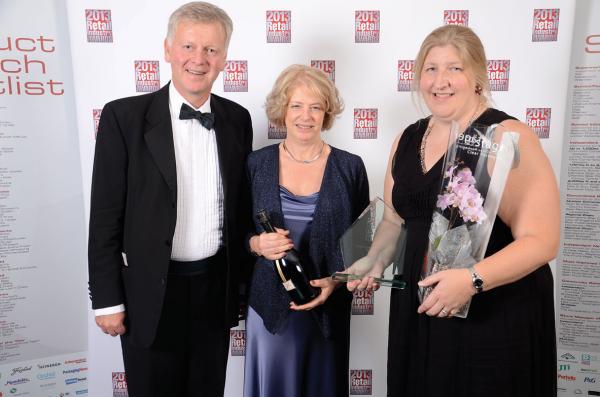 A picture of Staeger's director and two lady team members collecting an award